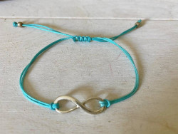 Bracelet sigle infini et cordon bleu turquoise